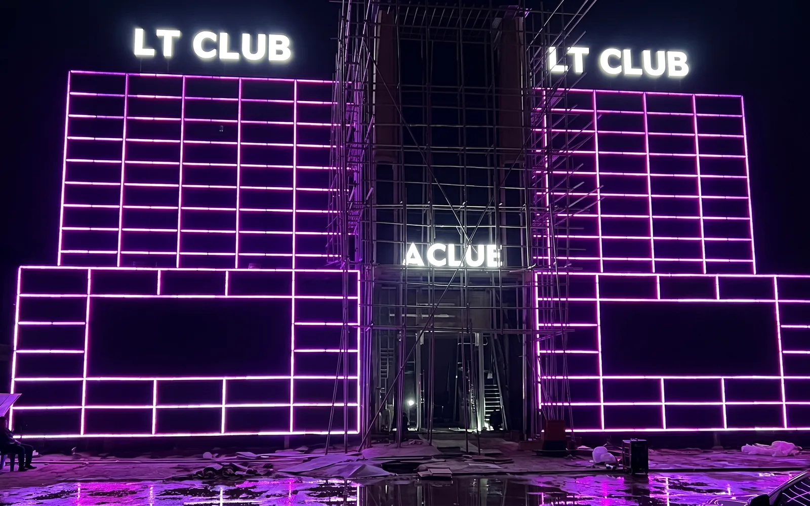 Animated pixel-bar facade on a commercial venue