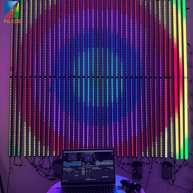 PILEDS pixel bar wall lit in full-spectrum RGB pattern with a MADRIX control laptop in the foreground