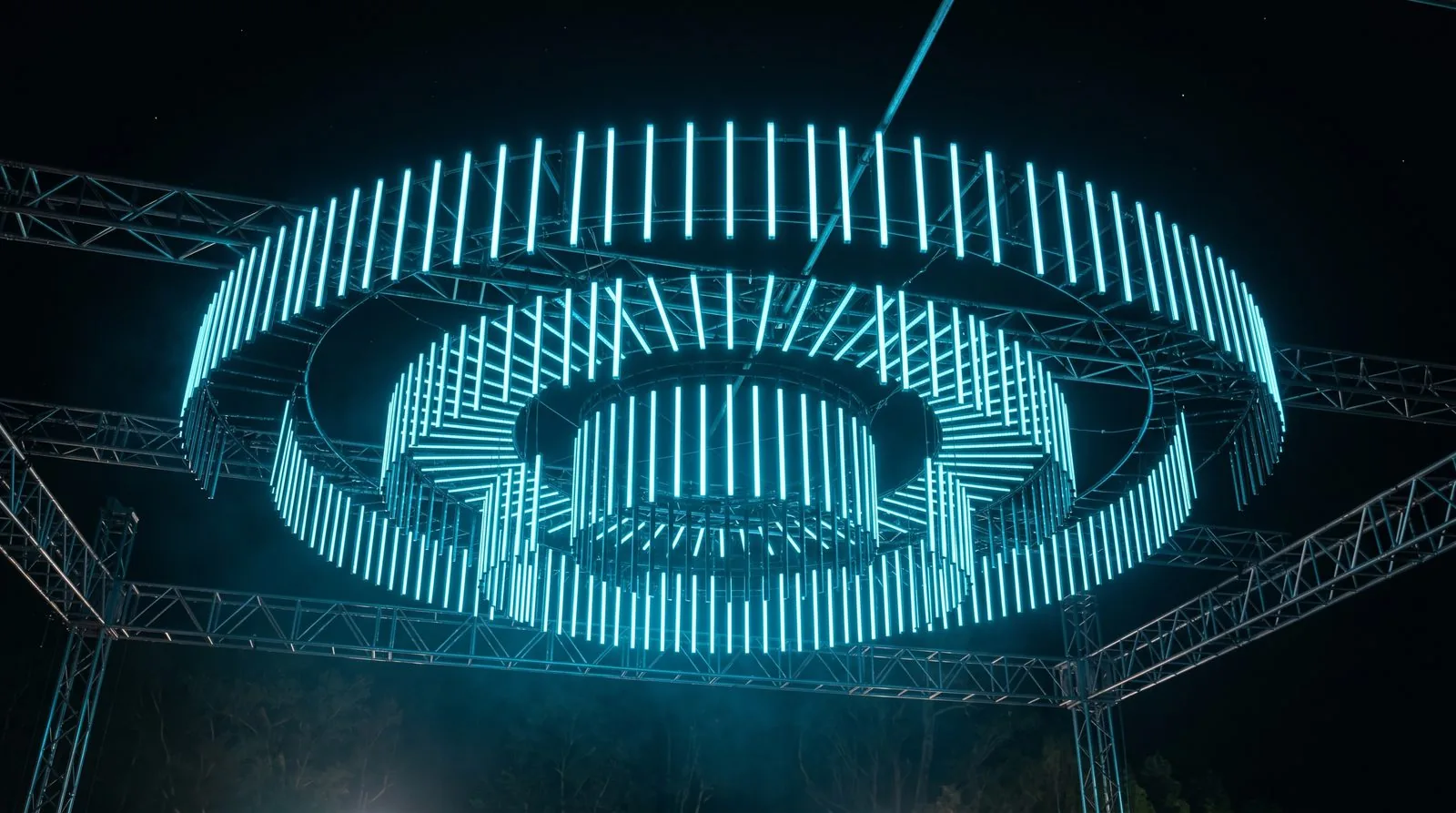 Custom PILEDS RGB pixel-bar installation forming a suspended circular ring