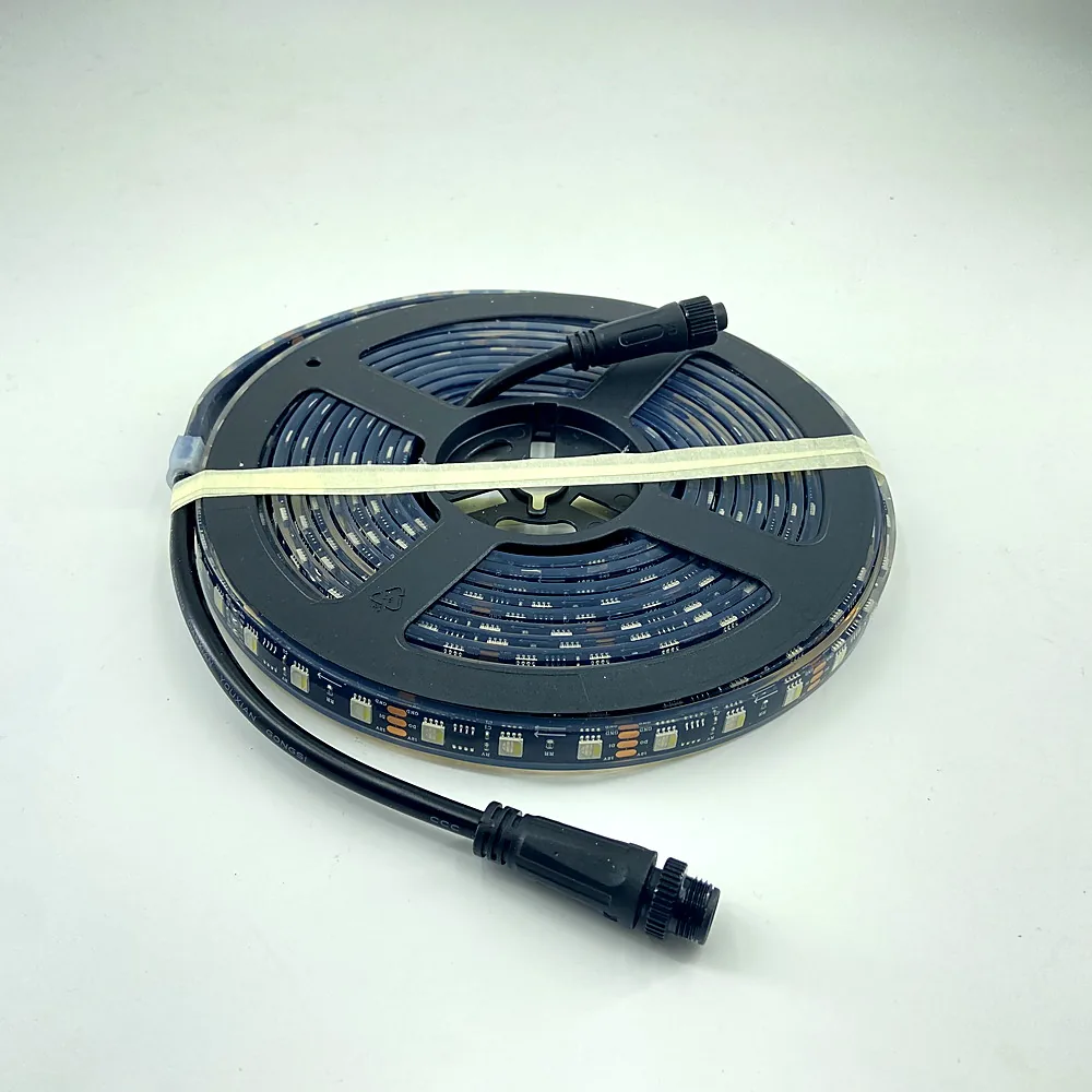 PILEDS addressable RGB LED strip lit in full-spectrum color on a reel